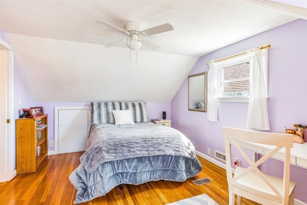31 Gerard Road Norwell, MA 02061 - Photo 21 of 30 a bedroom with a bed and a chandelier