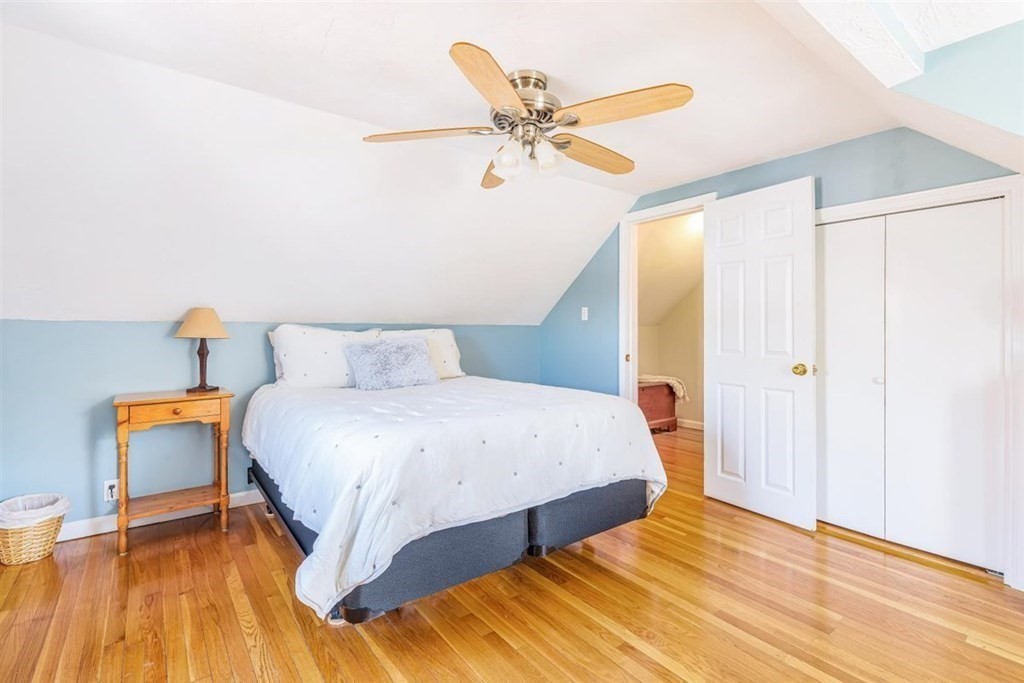 31 Gerard Road Norwell, MA 02061 - Photo 22 of 30 a bedroom with a bed and wooden floor