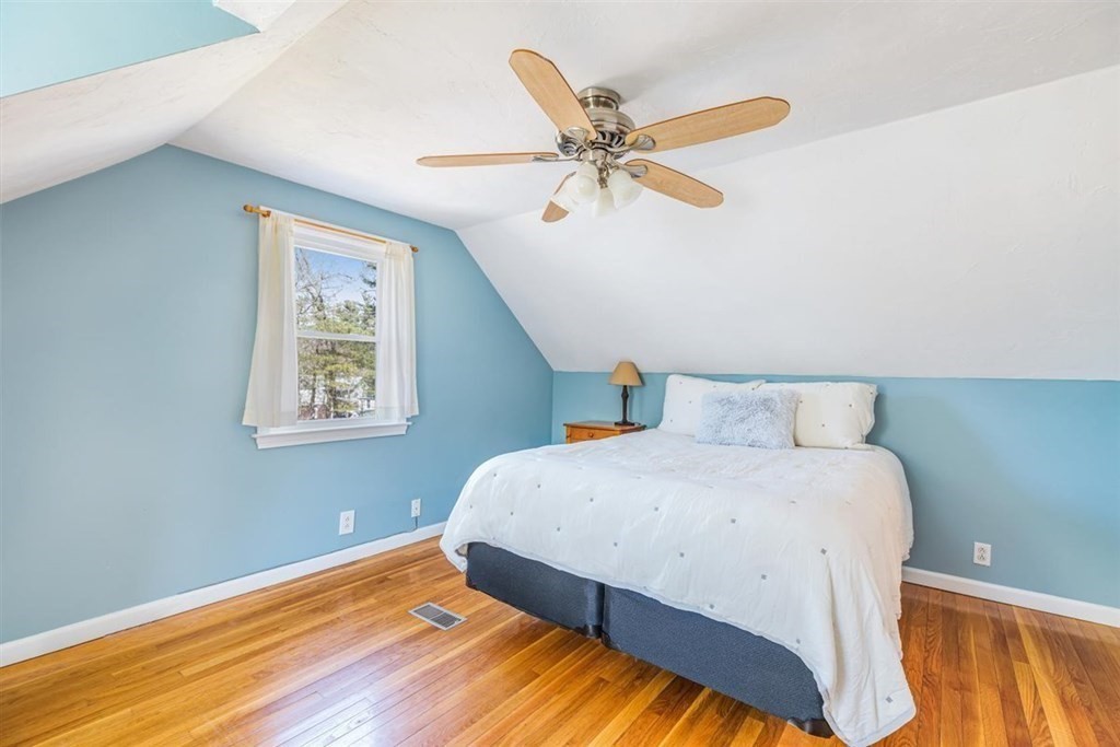 31 Gerard Road Norwell, MA 02061 - Photo 24 of 30 a bedroom with a bed and painting on the wall