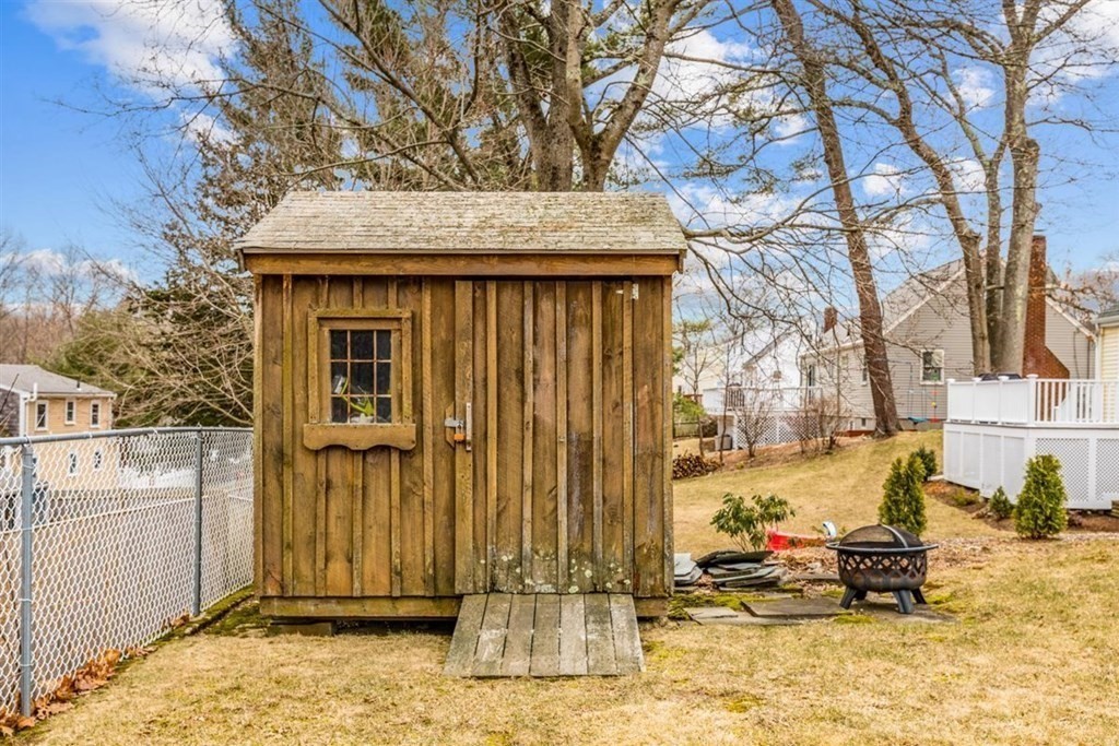31 Gerard Road Norwell, MA 02061 - Photo 27 of 30 a view of a house with a large tree and wooden fence