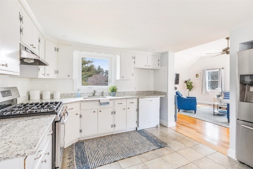 31 Gerard Road Norwell, MA 02061 - Photo 8 of 30 a kitchen with granite countertop a stove a sink and a refrigerator