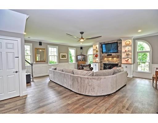 2 Snowy Owl Road Hopkinton, MA 01748 - Photo 12 of 30 a living room with furniture and a flat screen tv