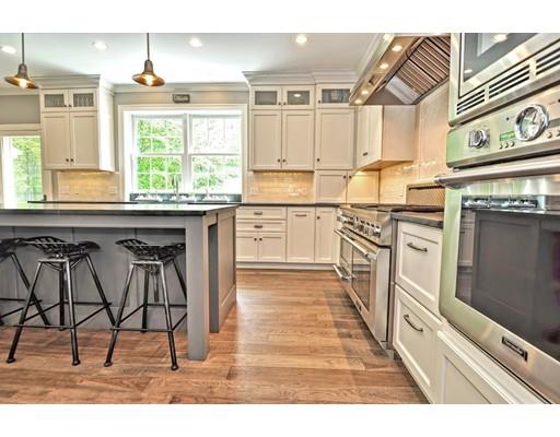 2 Snowy Owl Road Hopkinton, MA 01748 - Photo 6 of 30 a kitchen with stainless steel appliances granite countertop a stove a sink dishwasher and cabinets with wooden floor