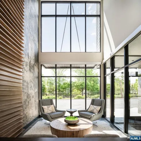 a living room with large windows