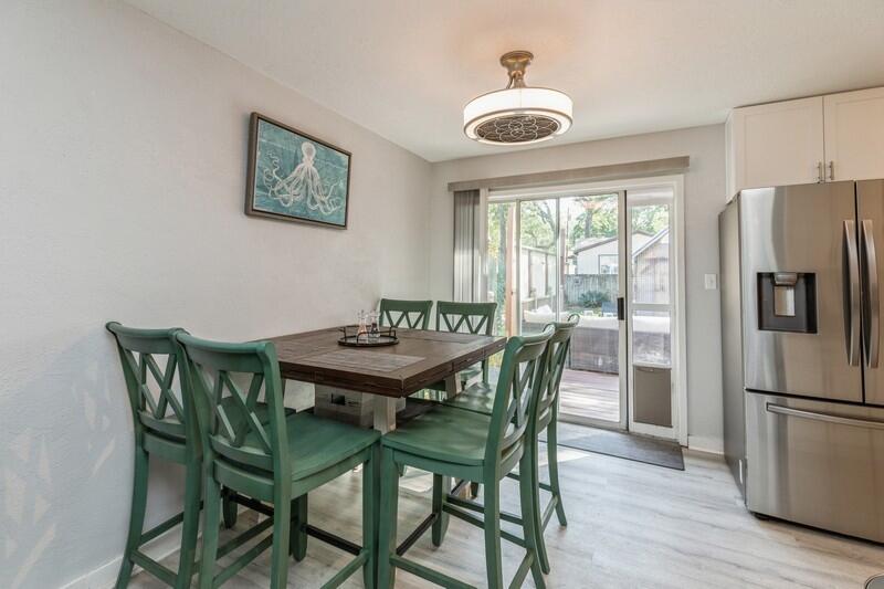582 Woodlow Road Niceville, FL 32578 - Photo 12 of 30 a view of a dining room with furniture window and wooden floor