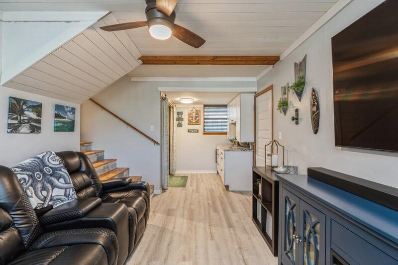 582 Woodlow Road Niceville, FL 32578 - Photo 13 of 30 a living room with furniture and a flat screen tv