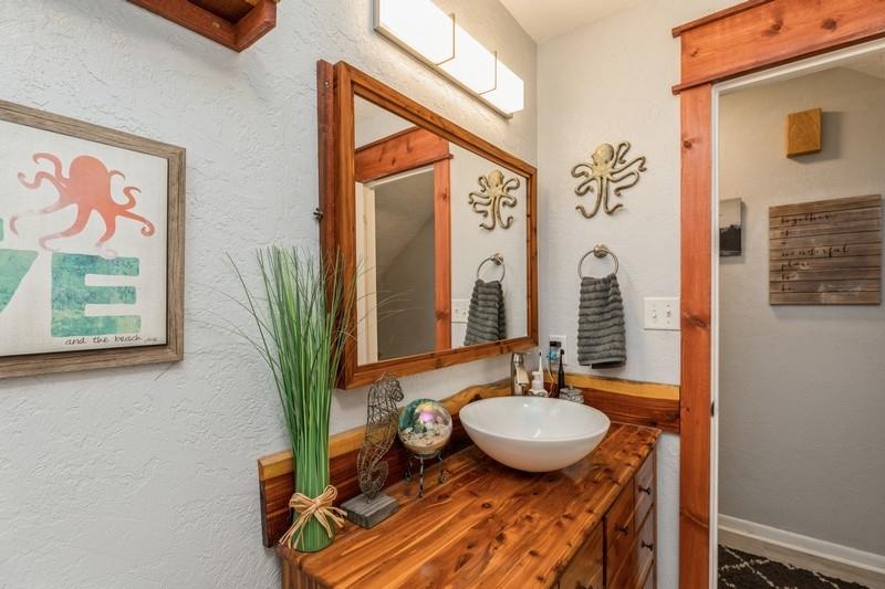 582 Woodlow Road Niceville, FL 32578 - Photo 19 of 30 a bathroom with a granite countertop sink and a mirror
