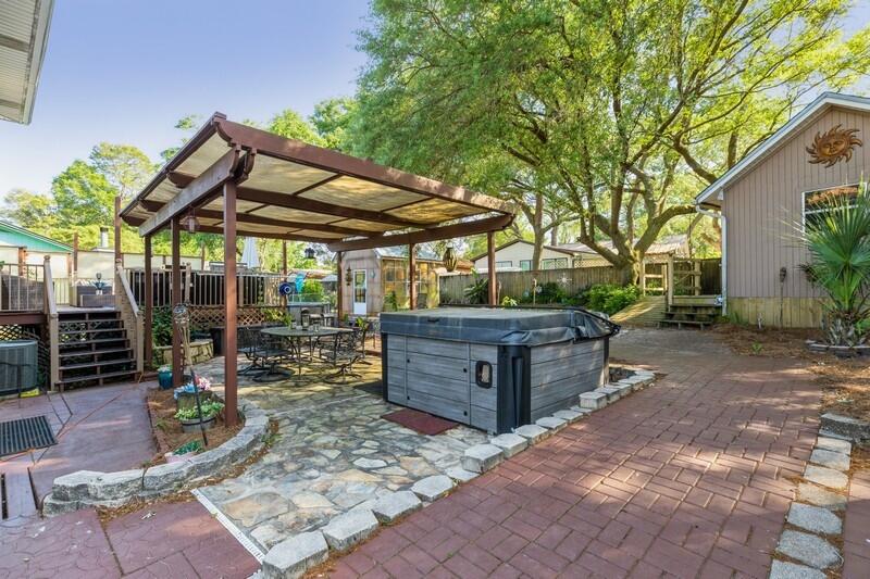 582 Woodlow Road Niceville, FL 32578 - Photo 25 of 30 a view of a backyard with sitting area and furniture