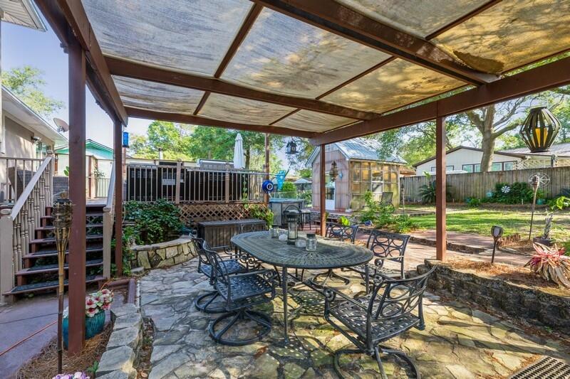 582 Woodlow Road Niceville, FL 32578 - Photo 29 of 30 a view of a patio with a table chairs and a backyard