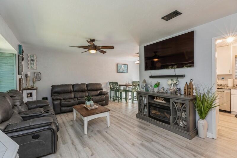 582 Woodlow Road Niceville, FL 32578 - Photo 6 of 30 a living room with furniture and a flat screen tv