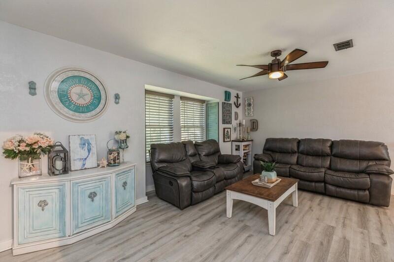 582 Woodlow Road Niceville, FL 32578 - Photo 8 of 30 a living room with furniture and a wooden floor