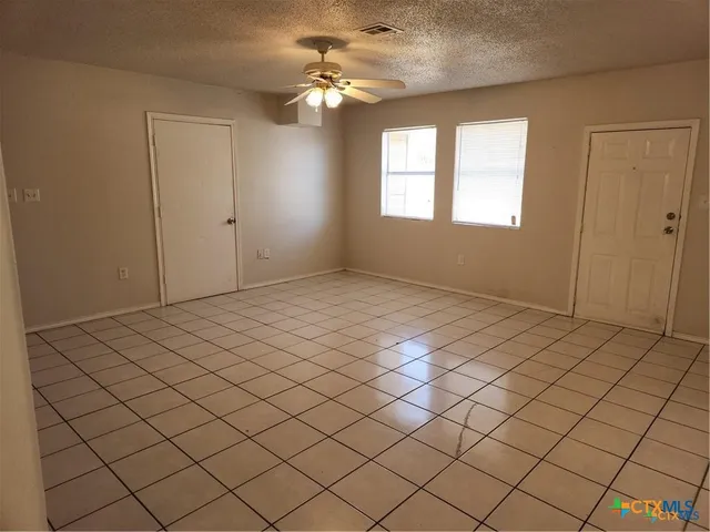a view of an empty room and window