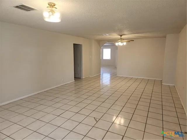 a view of an empty room and window