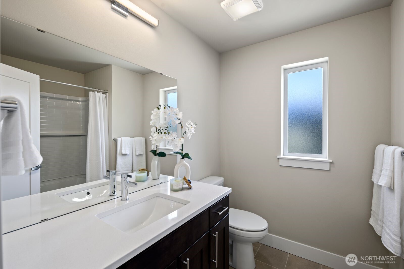 826 238th Place Southeast, Unit F Bothell, WA 98021 - Photo 19 of 39 a bathroom with a sink toilet and mirror
