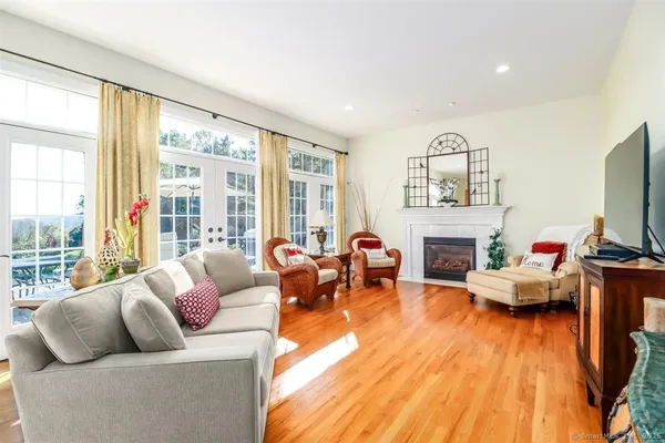 a living room with fireplace furniture and a flat screen tv