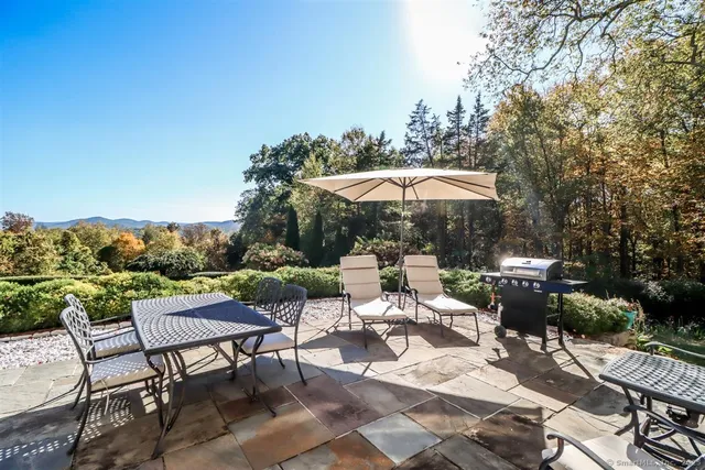 a view of a patio with furniture and table