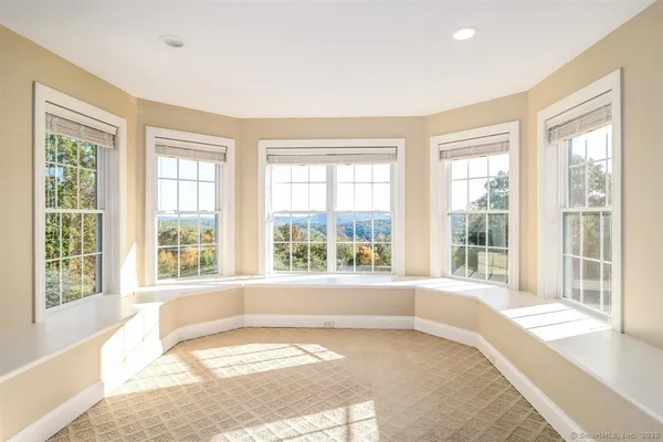a view of a livingroom with furniture and a window