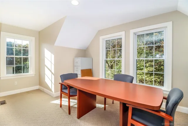 an aerial view of a house with a yard and balcony