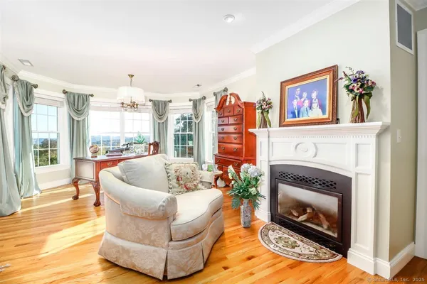 a living room with patio furniture and a window