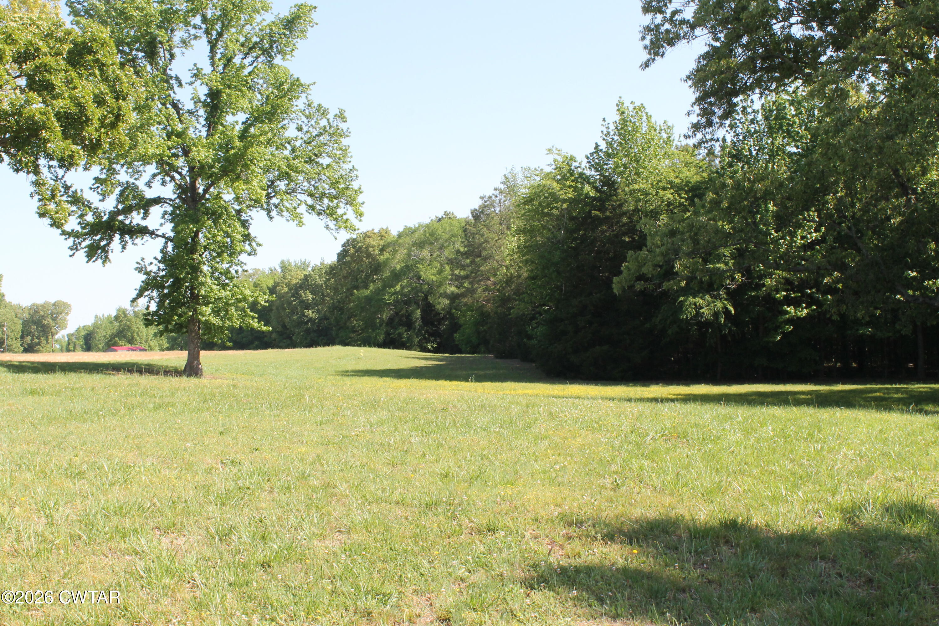 0 Williams Road Henderson, TN 38340 - Photo 23 of 29 a view of a swimming pool with an outdoor space and seating area