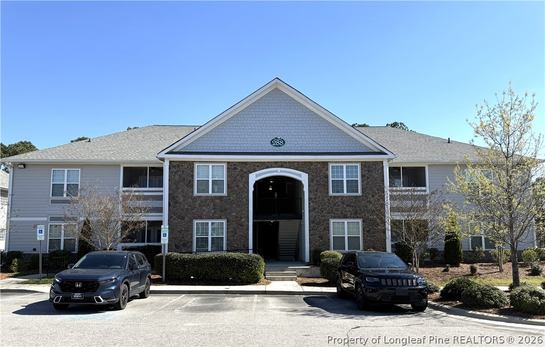 288 Gallery Drive, Unit 301 Spring Lake, NC 28390 - Photo 1 of 36 a front view of a house with cars parked