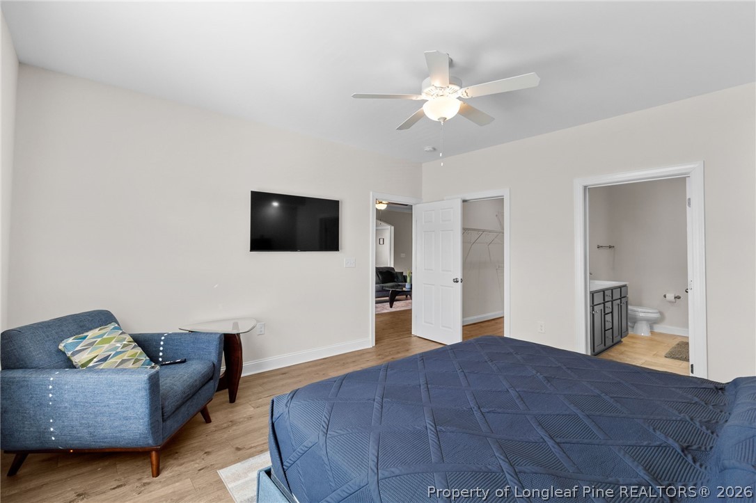 288 Gallery Drive, Unit 301 Spring Lake, NC 28390 - Photo 14 of 36 a spacious bedroom with a bed and a flat screen tv