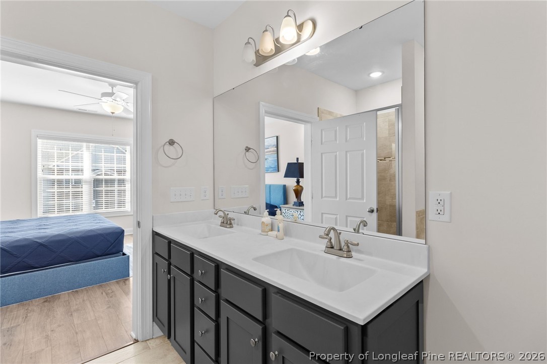 288 Gallery Drive, Unit 301 Spring Lake, NC 28390 - Photo 17 of 36 a bathroom with a sink double vanity and a mirror