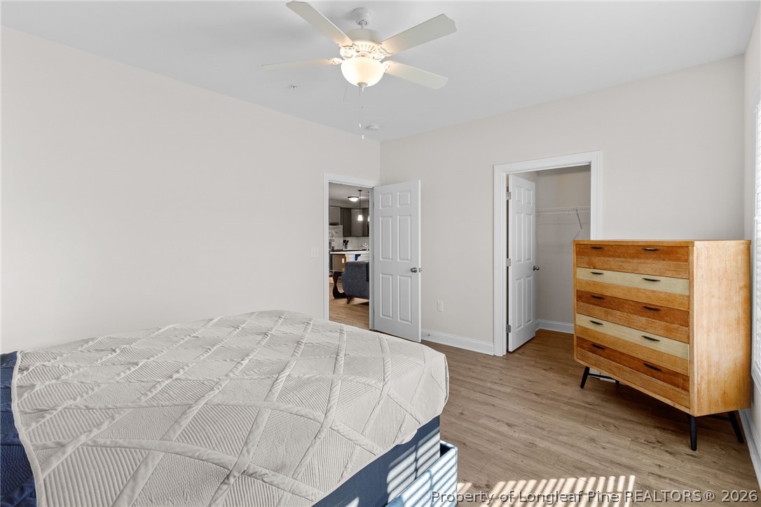 288 Gallery Drive, Unit 301 Spring Lake, NC 28390 - Photo 25 of 36 a bedroom with a bed and a cabinets