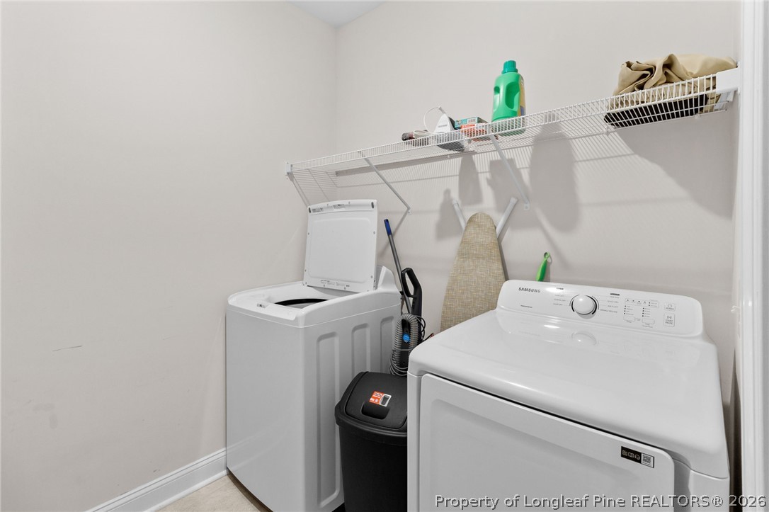 288 Gallery Drive, Unit 301 Spring Lake, NC 28390 - Photo 28 of 36 a utility room with dryer and washer