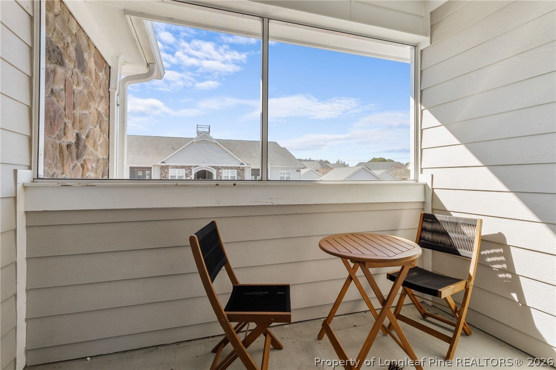288 Gallery Drive, Unit 301 Spring Lake, NC 28390 - Photo 29 of 36 a view of a chairs and table in a balcony