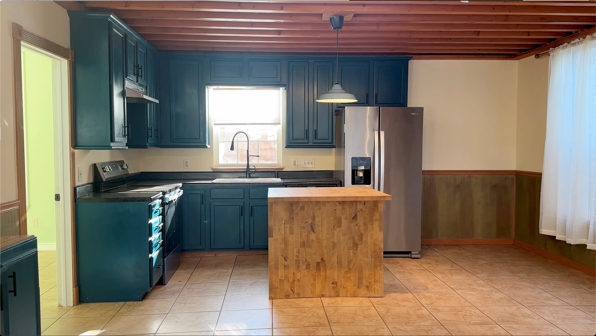 4303 Avenue A, Unit B Austin, TX 78751 - Photo 4 of 9 a kitchen with granite countertop a refrigerator and a stove