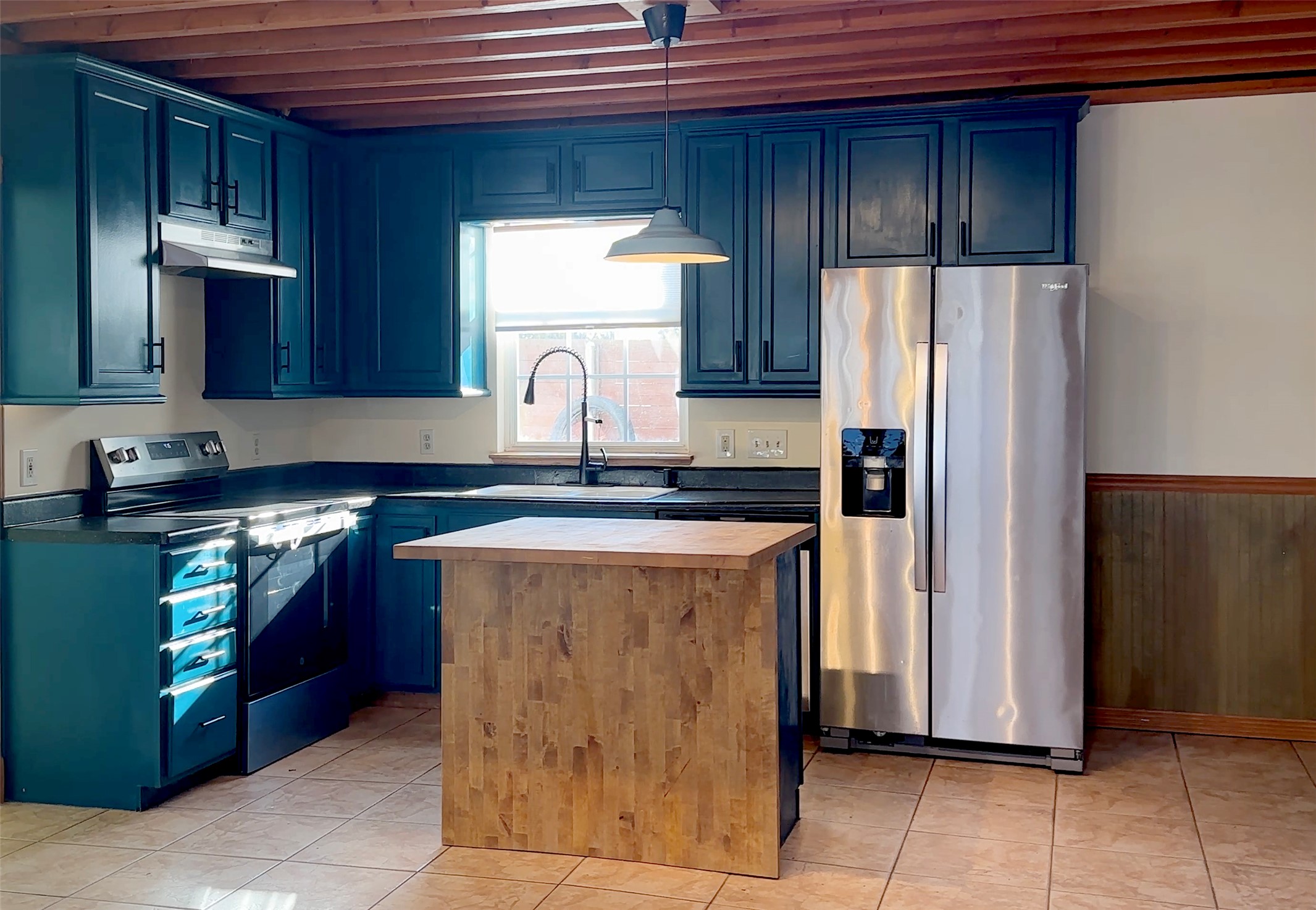 4303 Avenue A, Unit B Austin, TX 78751 - Photo 5 of 9 a kitchen with stainless steel appliances granite countertop a refrigerator and a stove