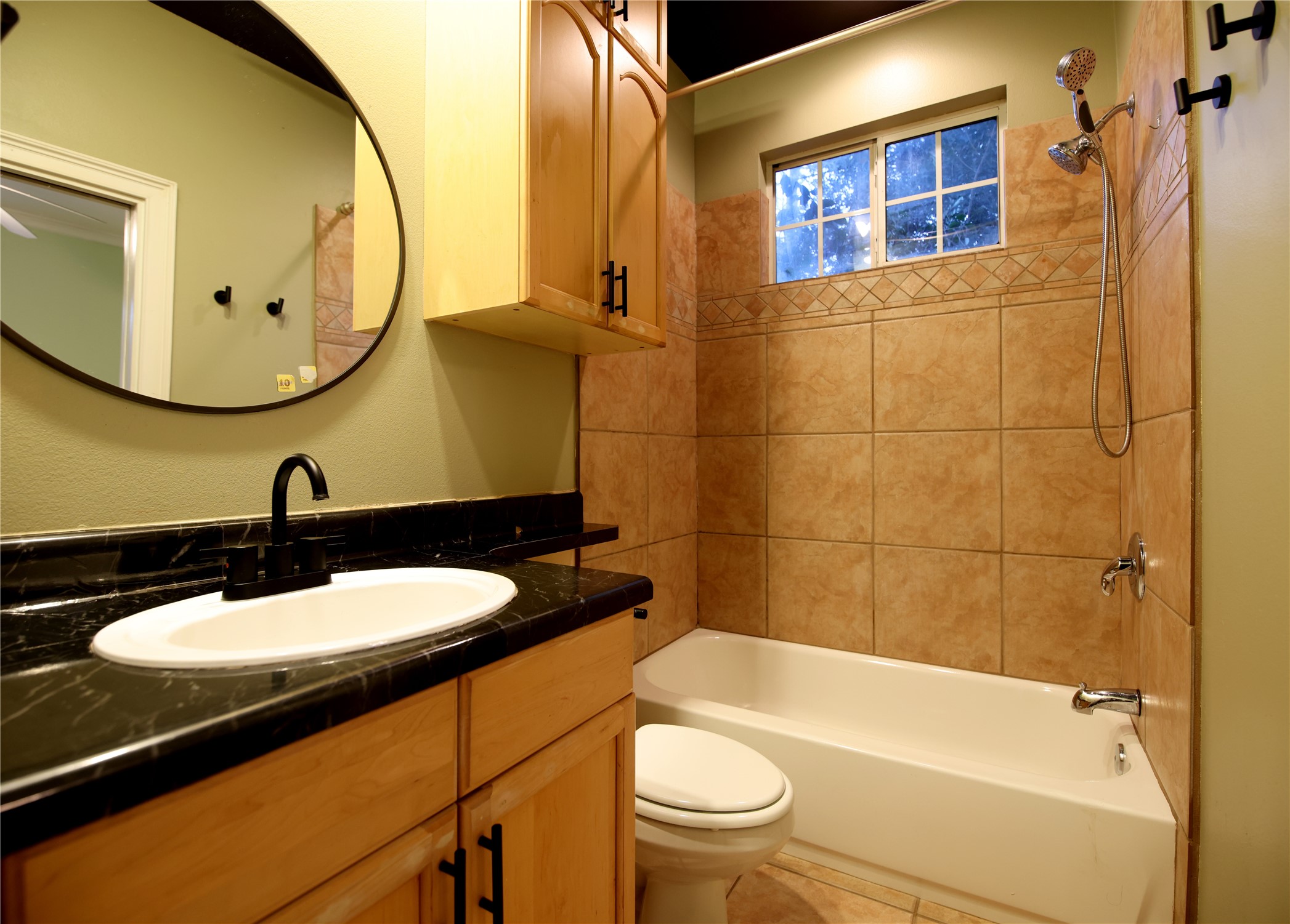 4303 Avenue A, Unit B Austin, TX 78751 - Photo 7 of 9 a bathroom with a sink a toilet and bathtub