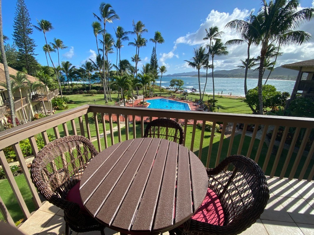 a view of a balcony with wooden floor