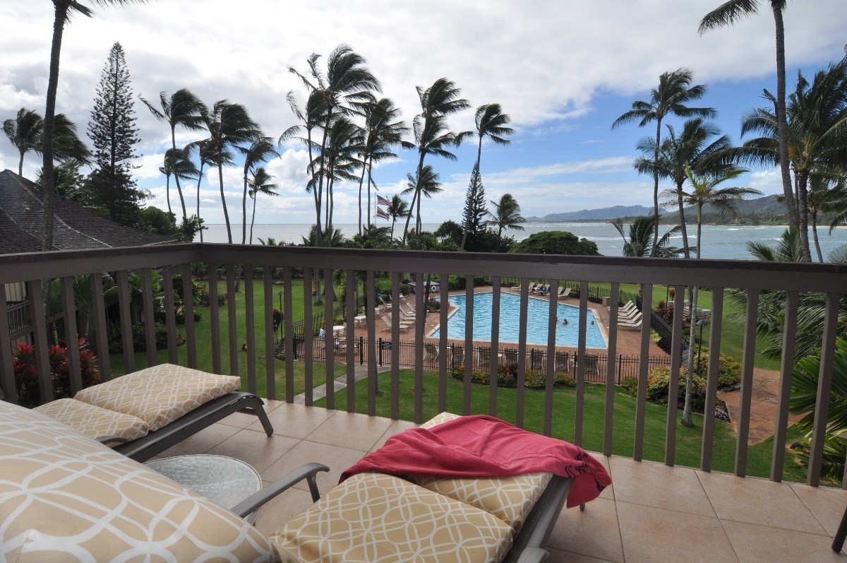 410 Papaloa Road, Unit 233 Kapaa, HI 96746 - Photo 4 of 13 a view of a lake with a table and chairs in patio