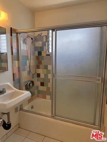 a view of hallway with stairs and a closet