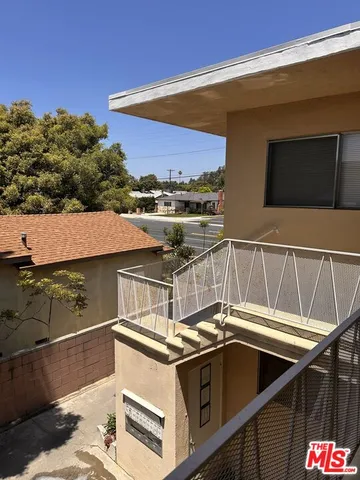 a view of a balcony with appliances