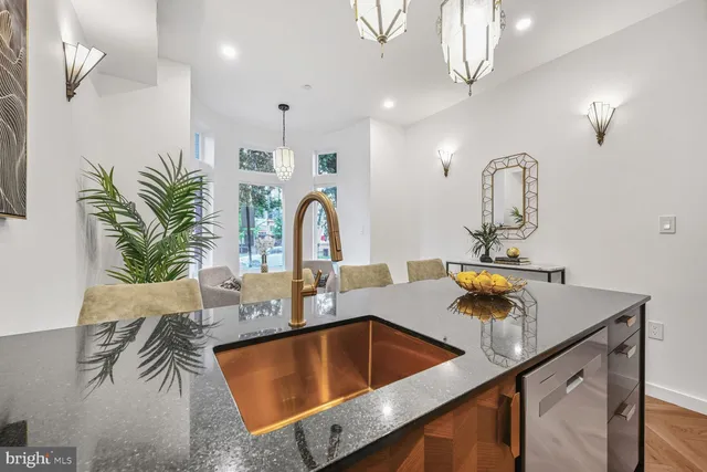 a kitchen with kitchen island a sink and a counter top space