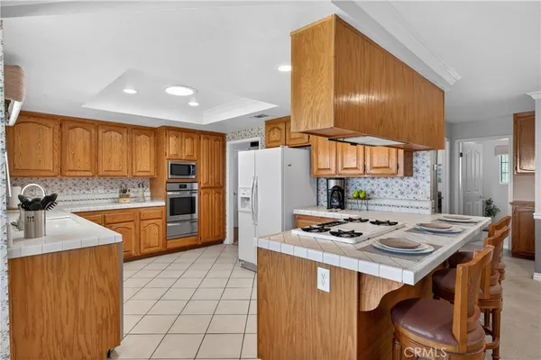 a kitchen with a sink stove and microwave