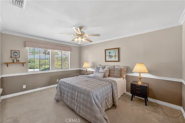 a bed room with a bed and a chandelier