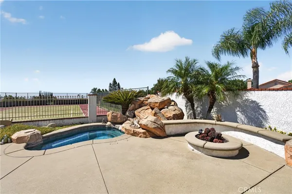 a view of a swimming pool and a yard