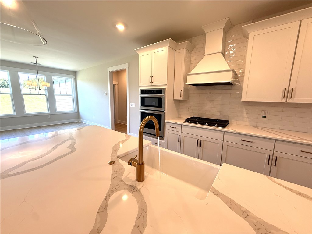504 Tilman Court Anderson, SC 29621 - Photo 11 of 28 This bright kitchen features sleek appliances and ample counter space, perfect for culinary adventures.