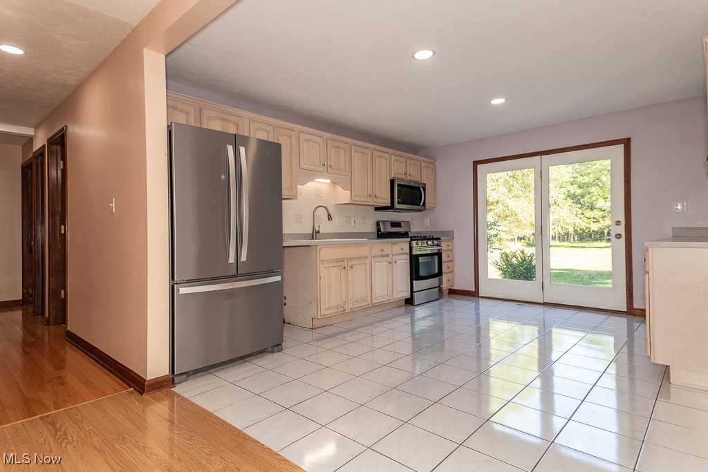 711 Lander Road Cleveland, OH 44143 - Photo 6 of 44 Kitchen with slider to brick patio