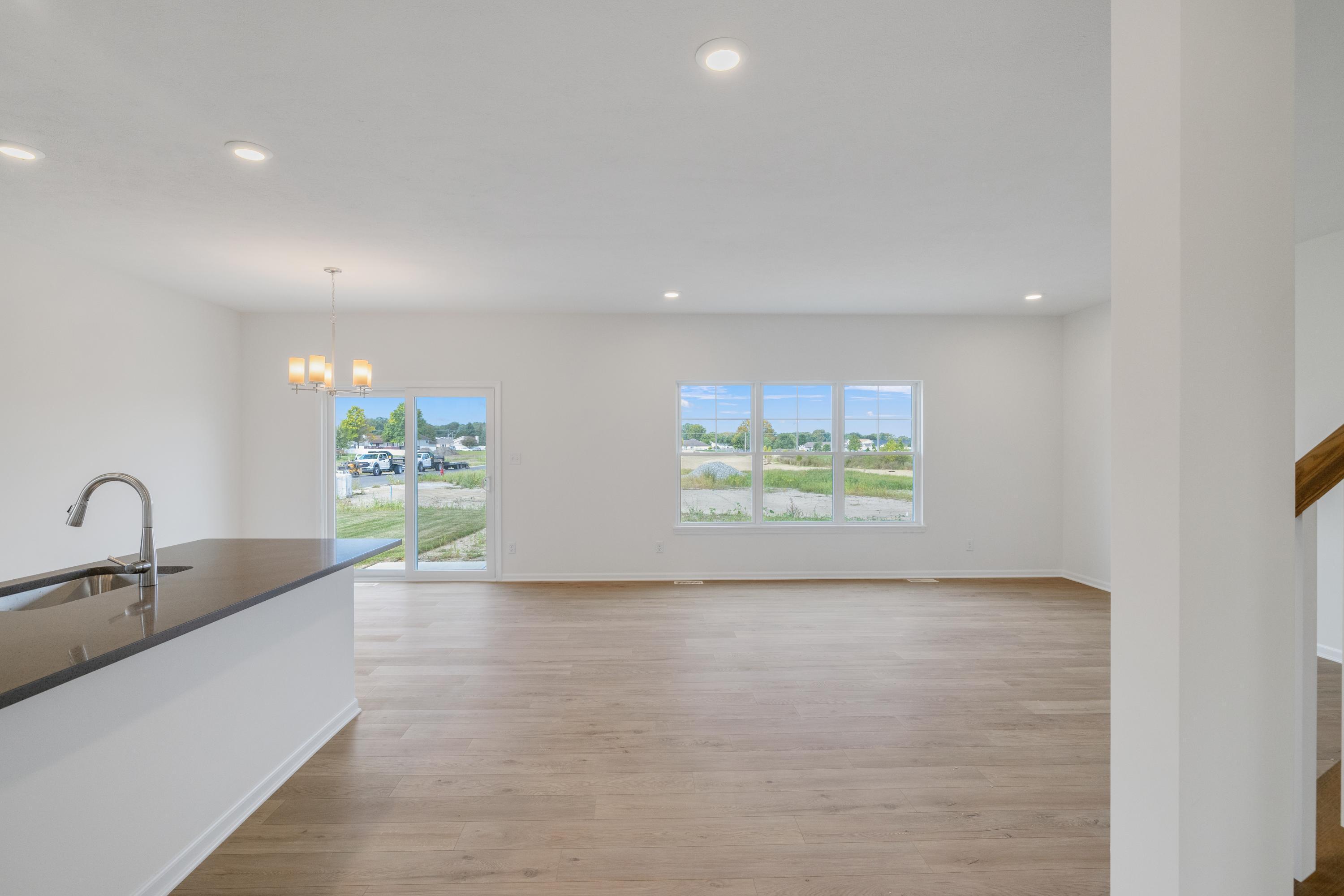 6852 Tucson Road Schererville, IN 46375 - Photo 8 of 28 a view of kitchen with stainless steel appliances granite countertop a sink and a large window
