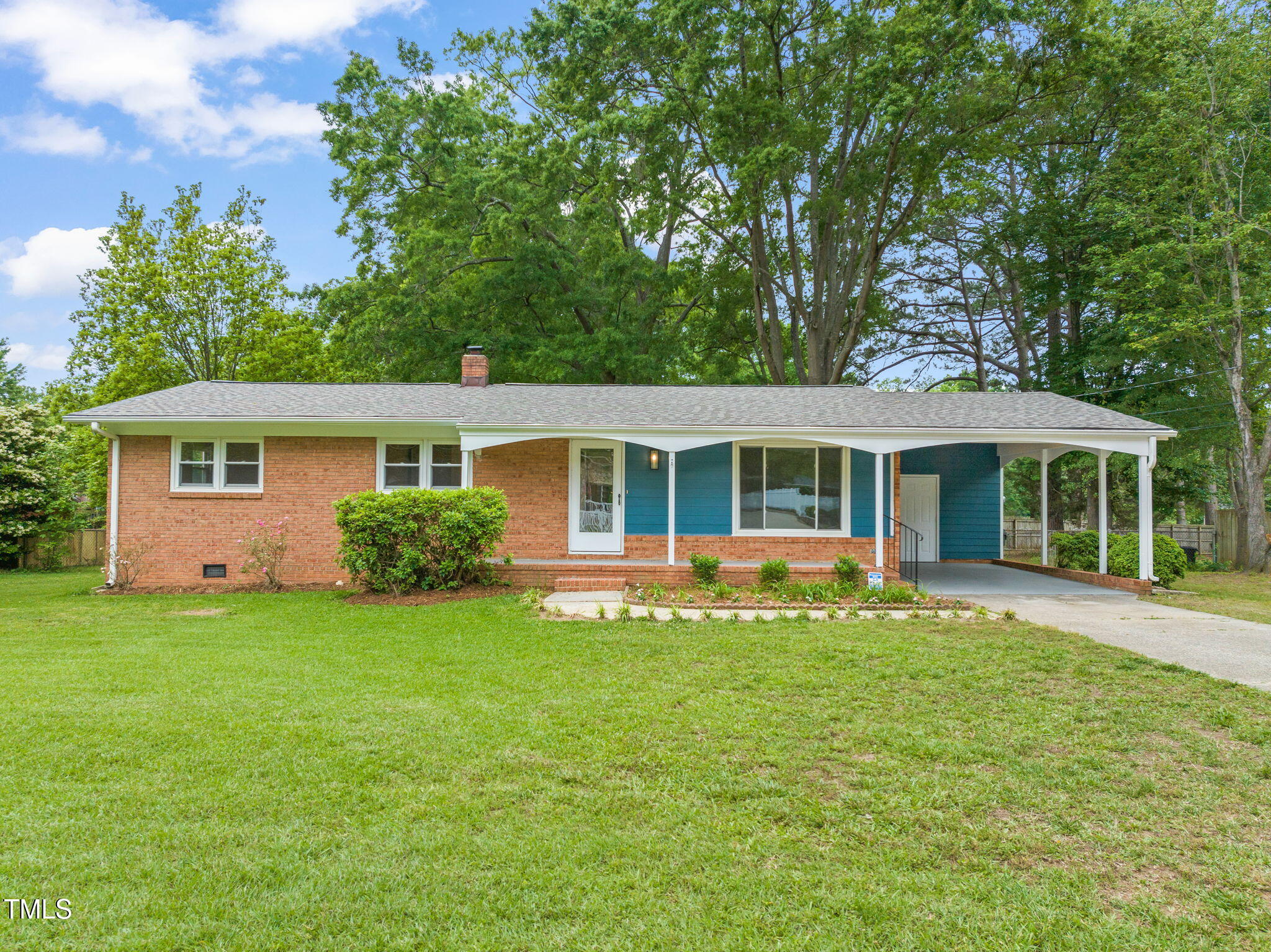 413 Winterlochen Road Raleigh, NC 27603 - Photo 1 of 44 front view of a house with a garden