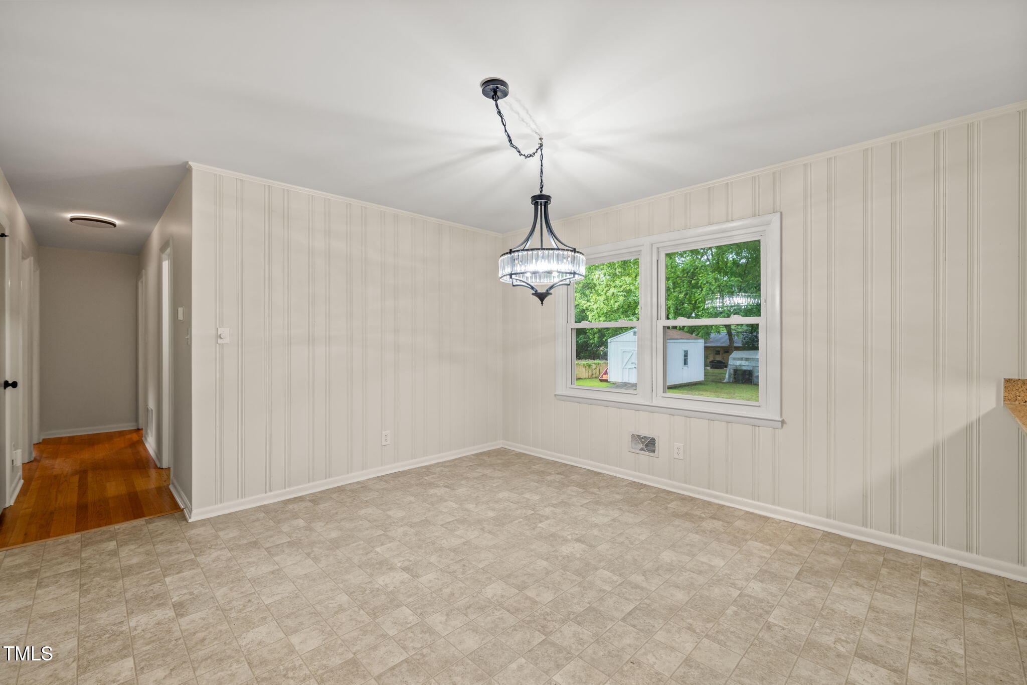 413 Winterlochen Road Raleigh, NC 27603 - Photo 12 of 44 a view of an empty room with a window