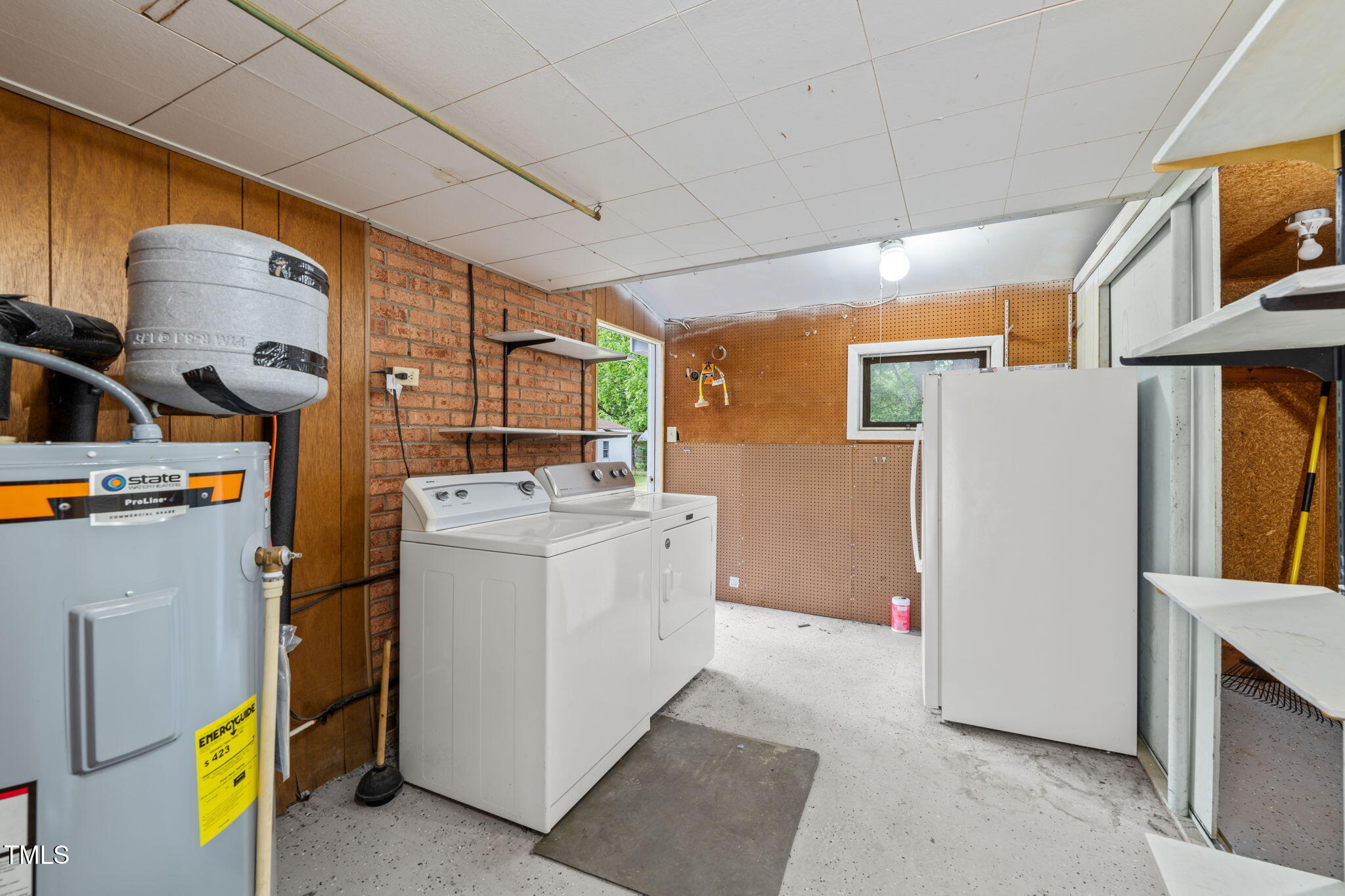 413 Winterlochen Road Raleigh, NC 27603 - Photo 23 of 44 a utility room with dryer and washer