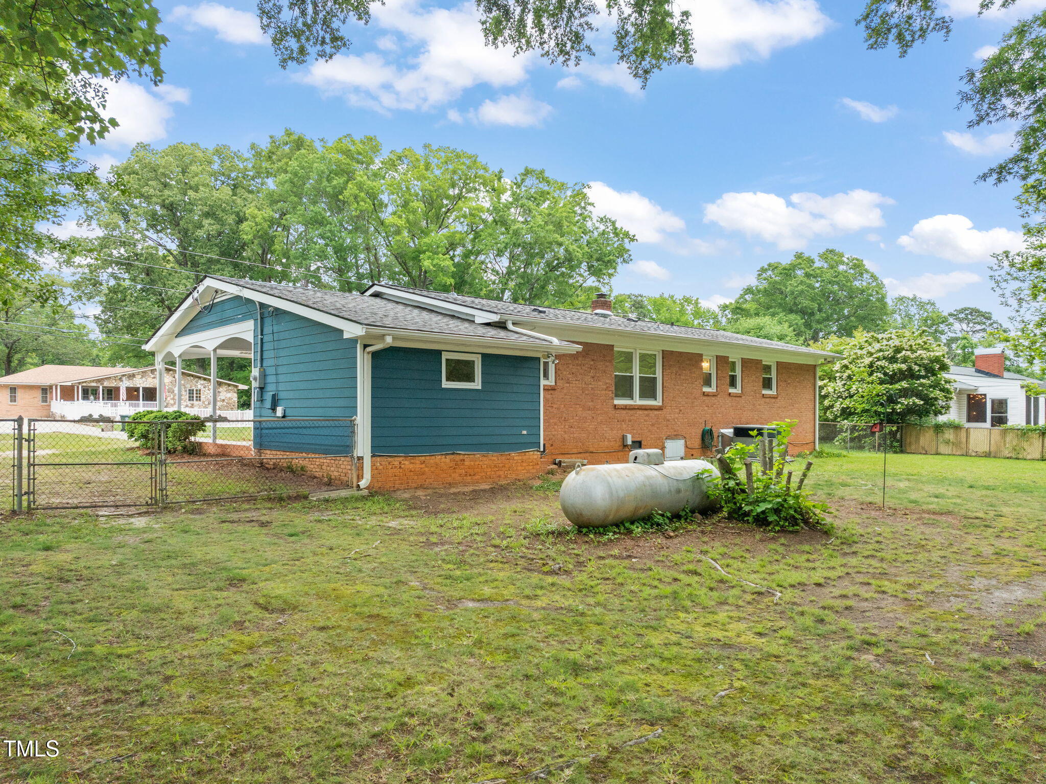 413 Winterlochen Road Raleigh, NC 27603 - Photo 26 of 44 a front view of house with yard and green space