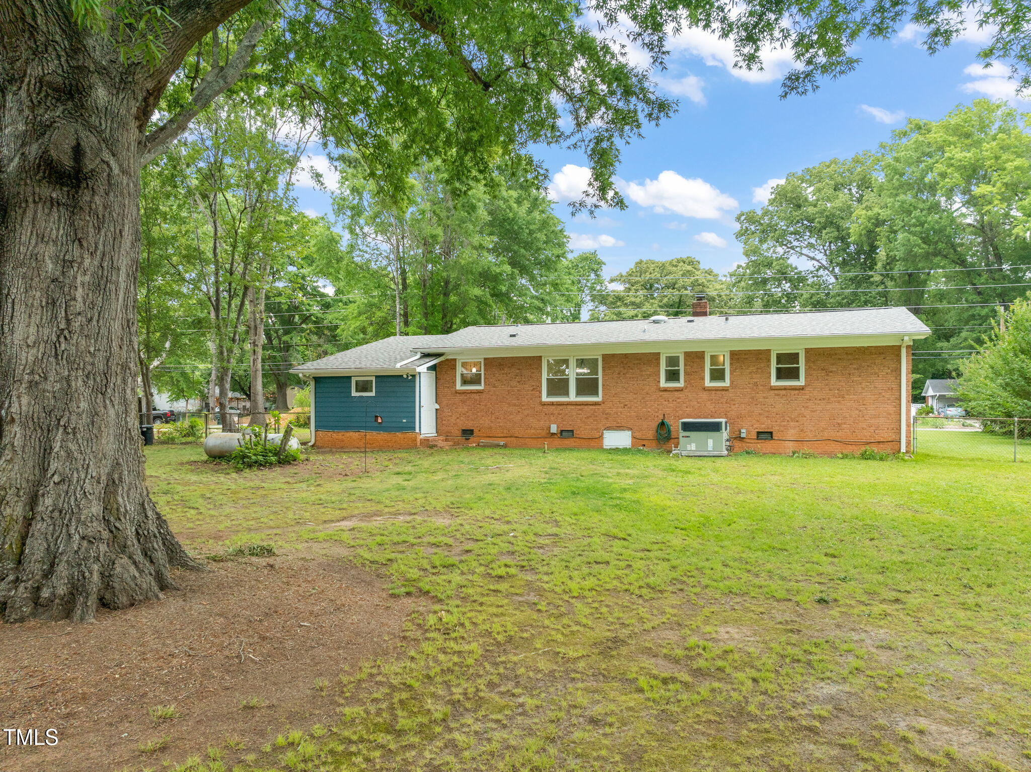 413 Winterlochen Road Raleigh, NC 27603 - Photo 27 of 44 a view of a house with a backyard