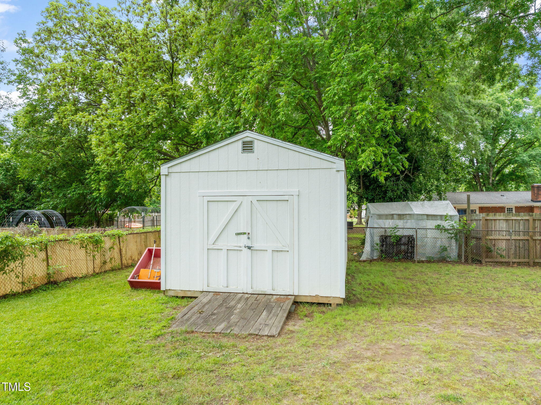 413 Winterlochen Road Raleigh, NC 27603 - Photo 28 of 44 a house view with a garden space